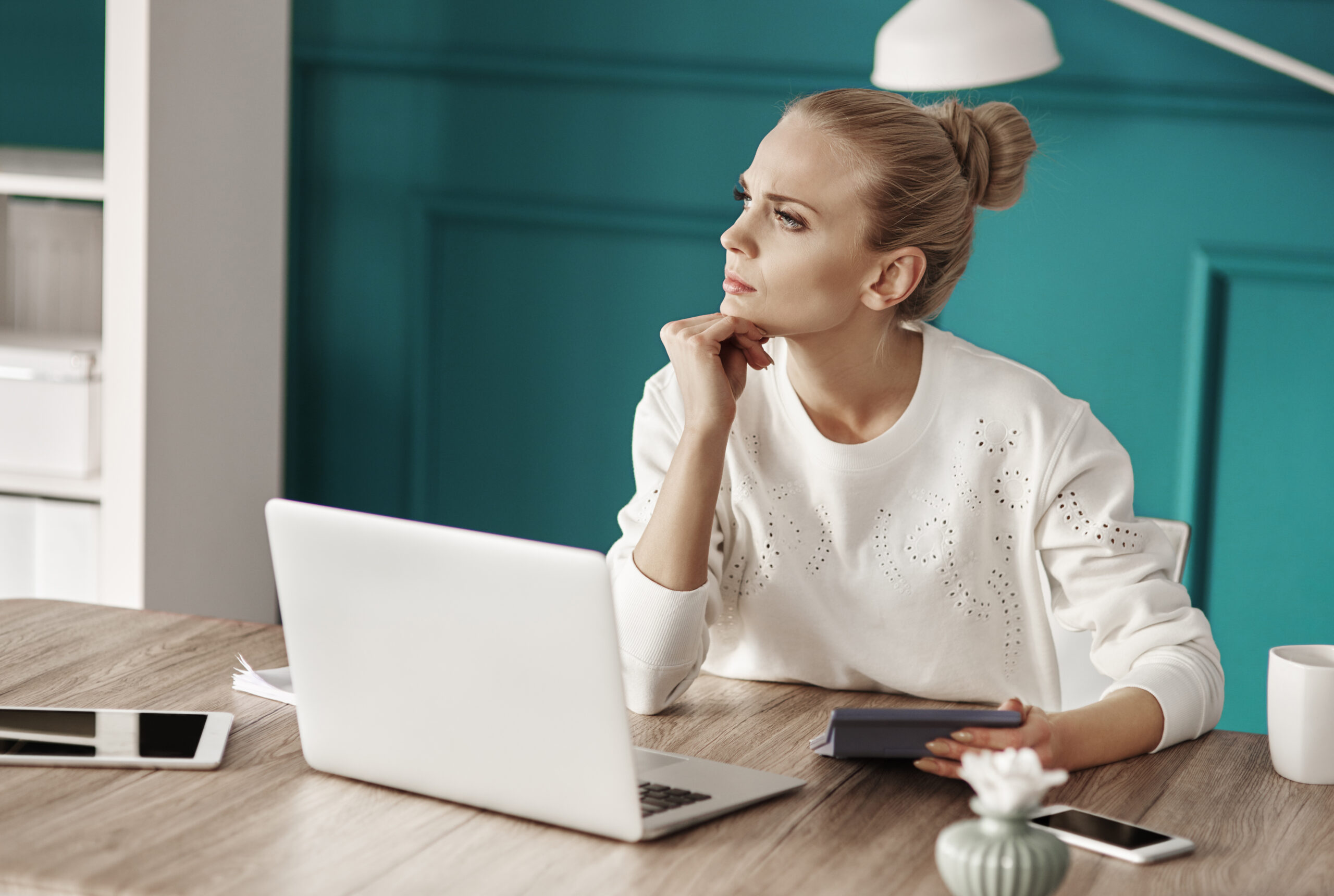 Serious woman planning her budget