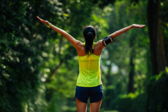 healthy woman stretching after a workout