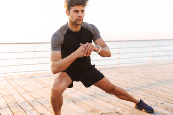 Man doing side lunges