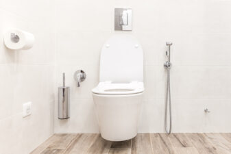 Toilet bowl in modern white hitech bathroom