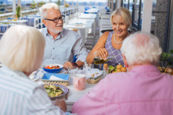 Elderly people dining at an outdoor restaurant