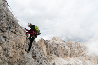 person climbing a mountain