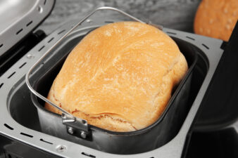 Freshly baked loaf in bread machine, closeup