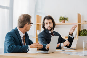 two adult men in an interview