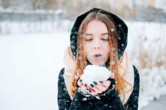 Woman with snowball in hand