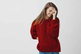 Woman wearing an oversized red sweater