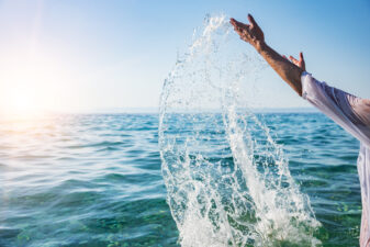 Hands splashing in water