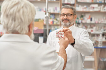 man shopping for pills at a pharmacy