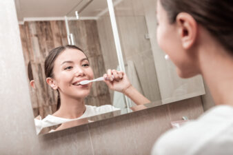 Woman brushing her teeth