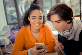 Girl showing her phone to her boyfriend