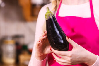 Woman holding eggplant