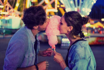 Couple eating cotton candy together