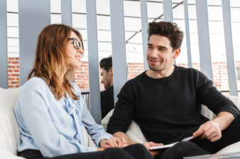 Woman and man speaking with each other