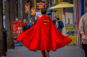 Man walking with Superman cape