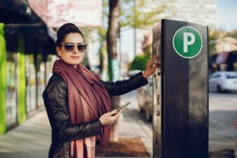 woman pays for Parking