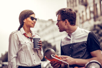 Woman and man talking outside