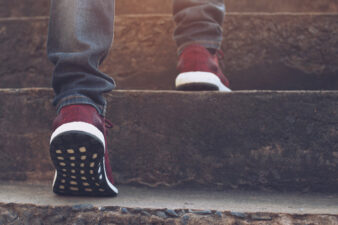 closeup of feet walking up the stairs