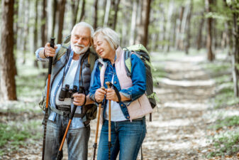 Senior couple hiking in the forest