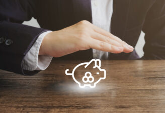 Businessman holding hand over a virtual piggy bank