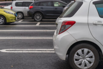 row of cars in parking lot