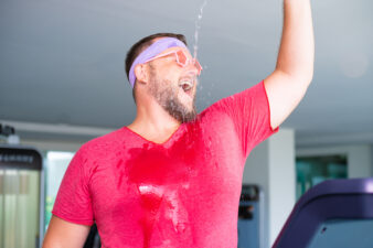 Funny mat working out and spilling water on himself