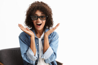 African-American woman screaming in surprise while wearing sunglasses