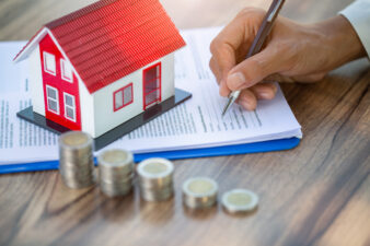 Person signing paper for a mortgage