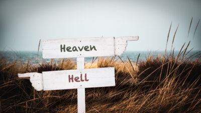 Signs pointing one way for heaven and one way for hell