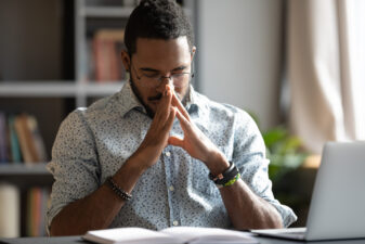 Black man concentrating at his desk