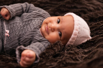 Adorable black girl with pink beanie