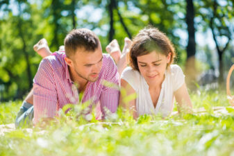 couple lying in the grass