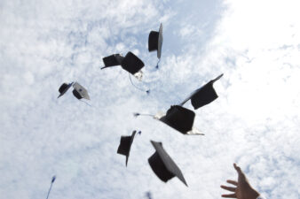 graduation hats in the air