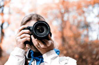 female photographer taking a picture outside