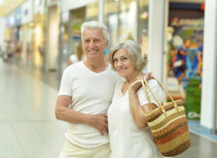 older man and woman at a mall