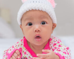 Portrait of a cute surprised newborn