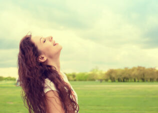 Woman practicing deep breathing