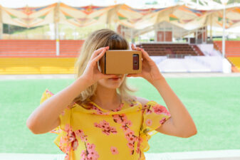 young woman looking at a VR headset