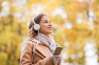 Woman on a walk listening to headphones