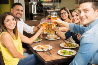 Five friends making a toast with beer