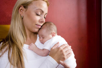 Loving mother holding her baby