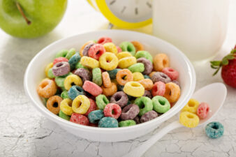 Colorful sugary cereal in white bowl