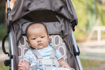 baby boy sitting in a stroller