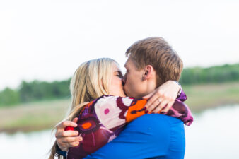 woman and man kissing and hugging