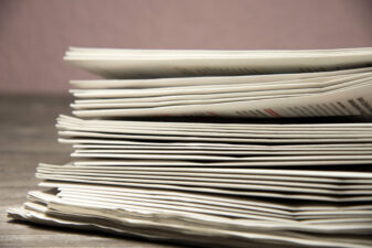 Stack of newspapers on the table