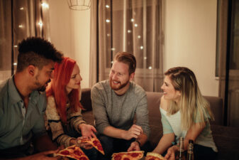 Friends enjoying pizza together