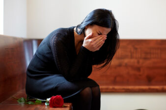 crying woman at funeral