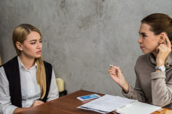 two women speaking about business