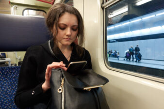 Upset girl on her phone on train