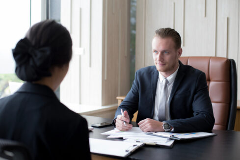 man interviewing a woman