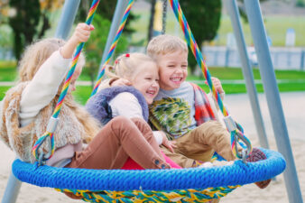 three children playing in the park